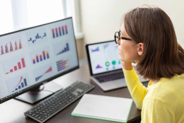 Caucasian advisor financial business analytics woman with data dashboard graphs